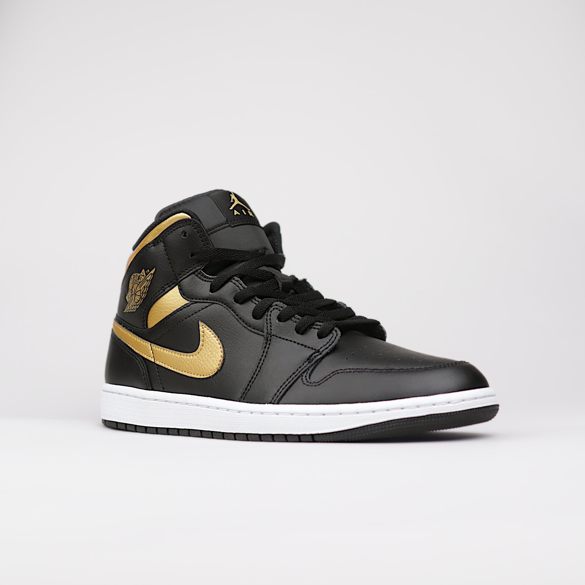 Jordan 1 Mid Black Metallic Gold